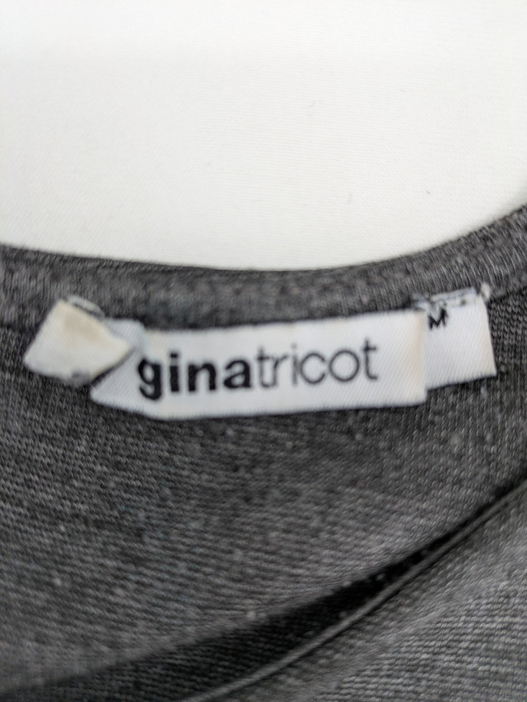Ginatricot grey A-line skater dress with 3/4 sleeves and visible back zipper.