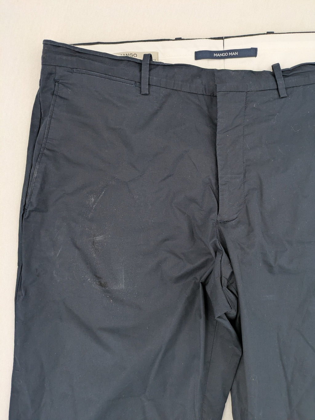 Mango Man black chinos flat front design with zipper and button closure.
