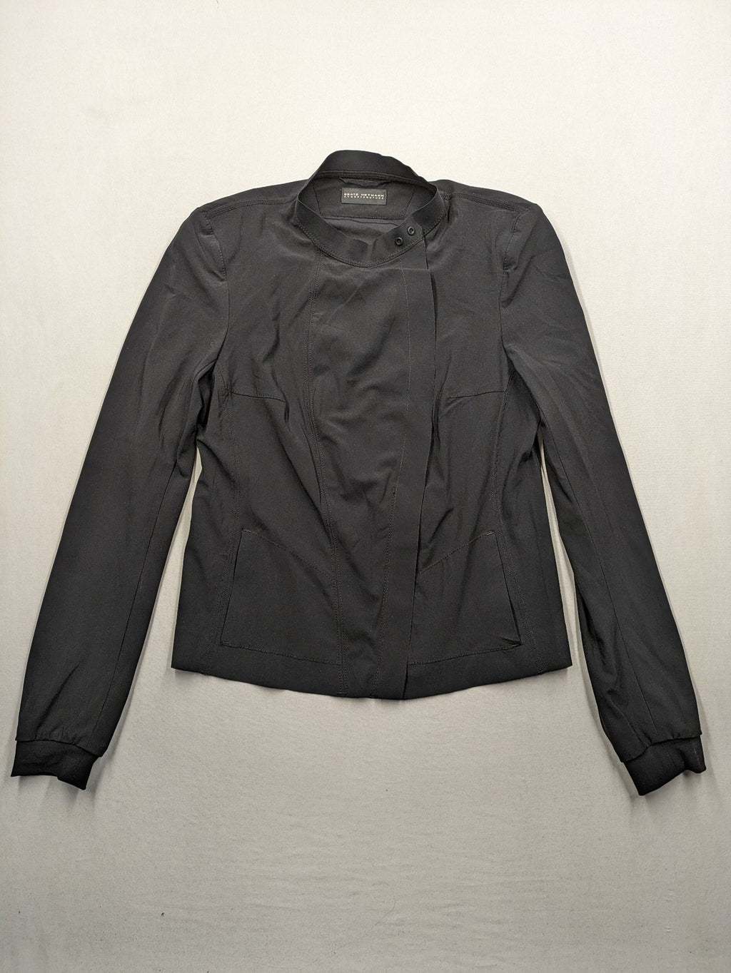 Beate Heymann black biker jacket with asymmetrical front and stand-up collar, stretch material.