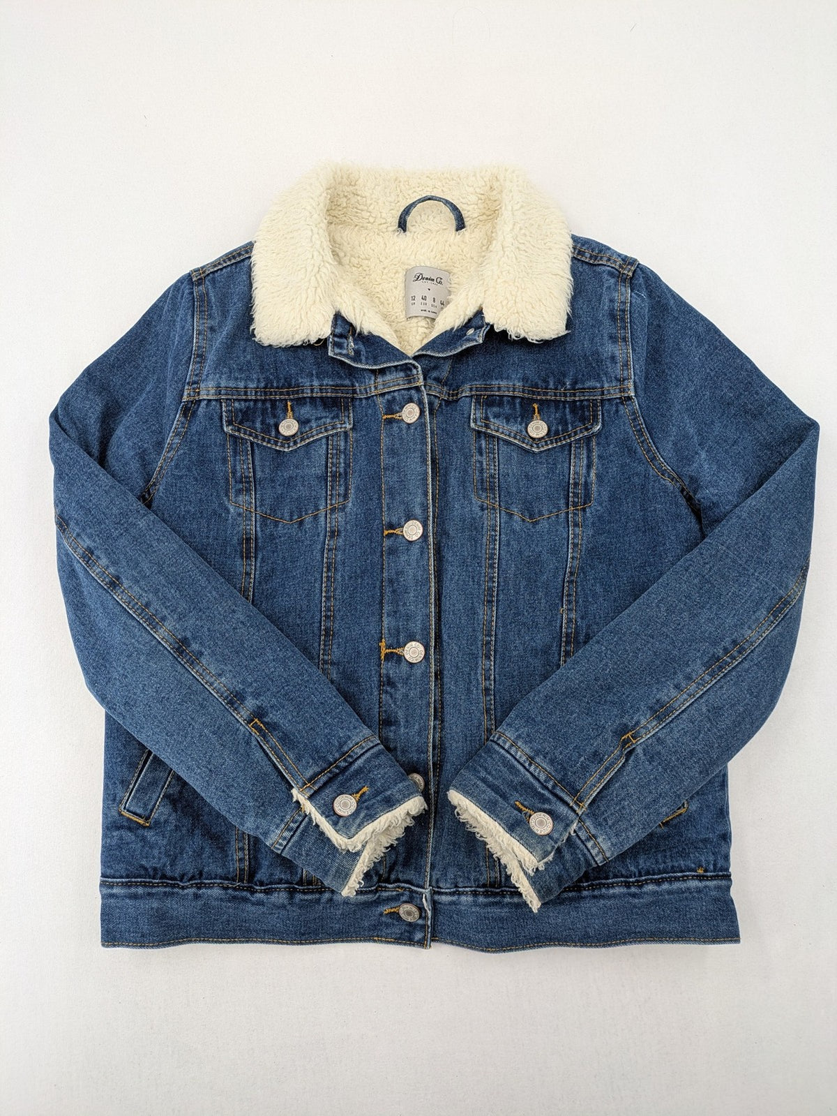 Denim & Co. blue jacket with cream Sherpa lining, button closure, and pockets.