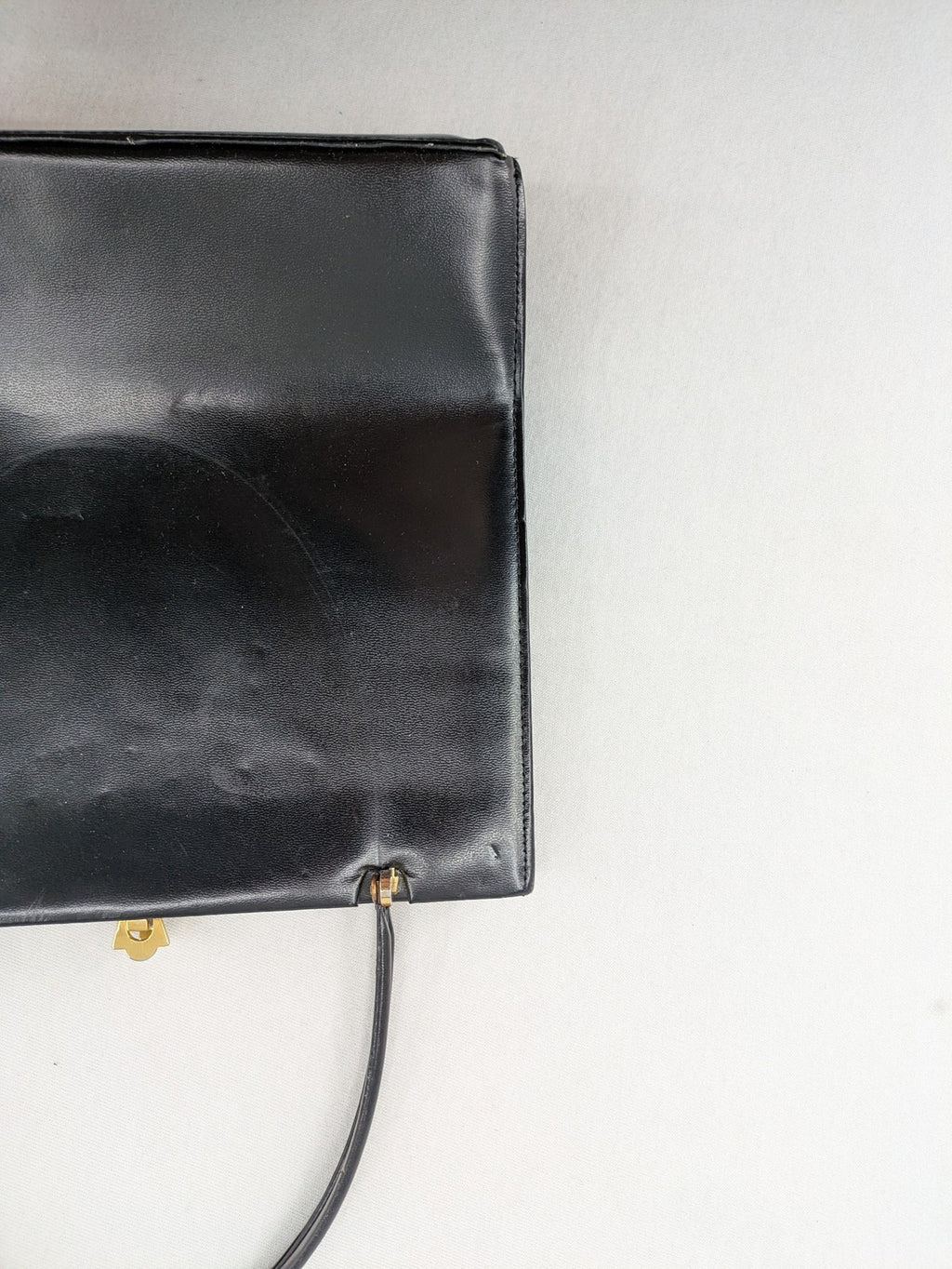 Eleganz black messenger bag vintage 50s 60s style with structured shape and gold accents.