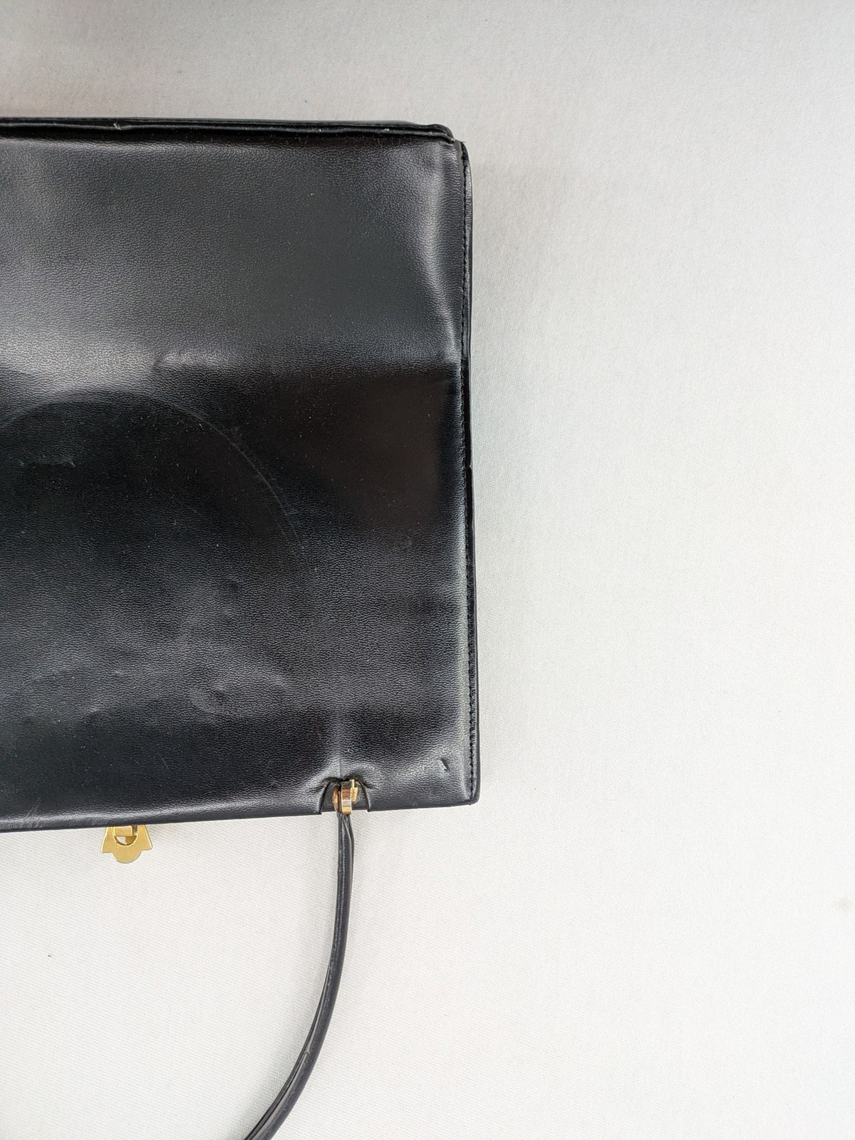 Eleganz black messenger bag vintage 50s 60s style with structured shape and gold accents.