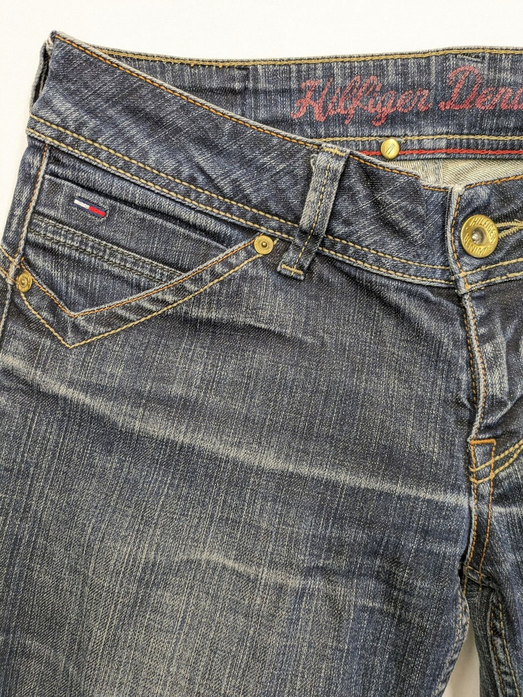 Tommy Hilfiger Denim blue straight jeans with low rise and slight used effects.
