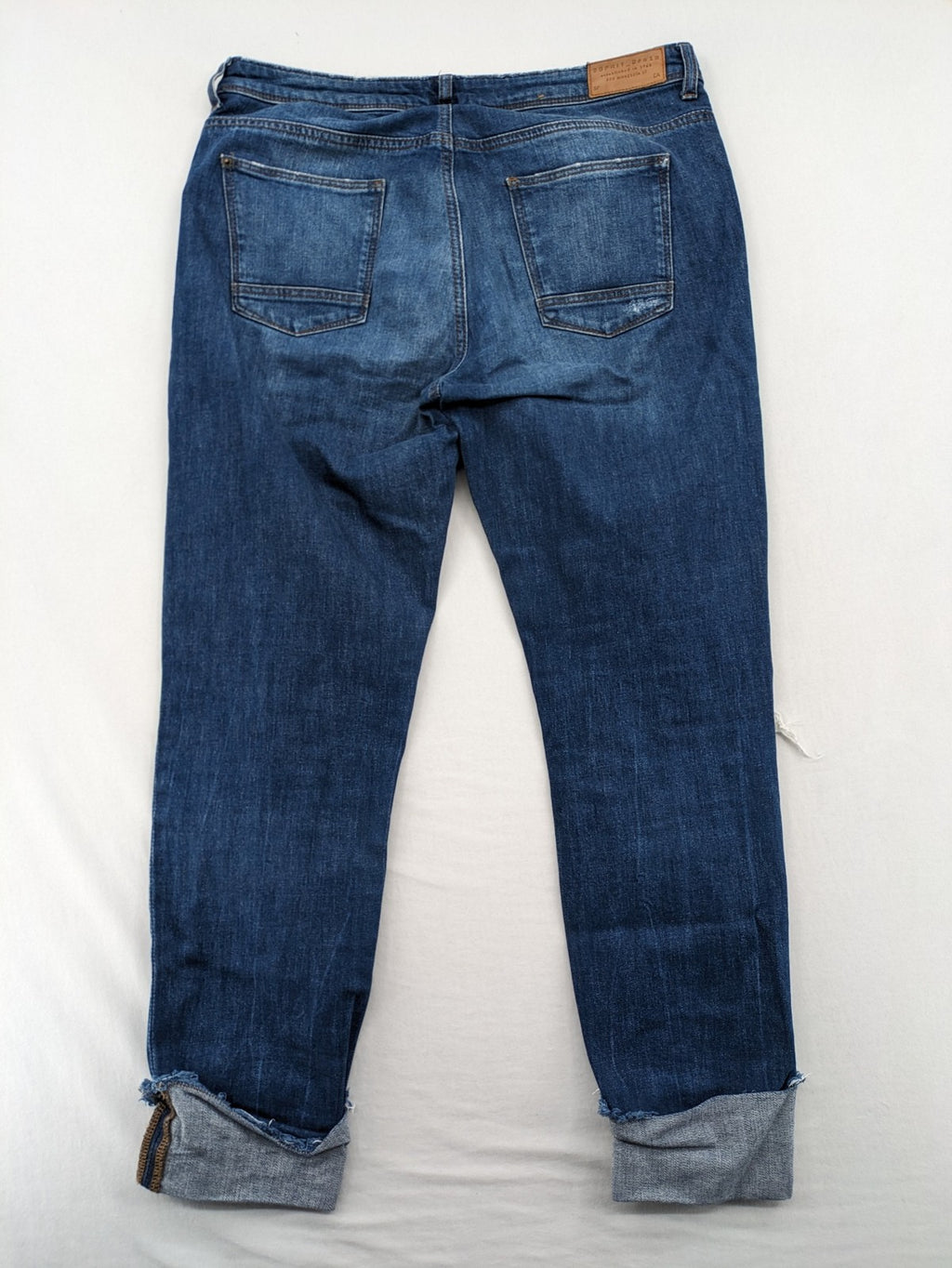 Esprit blue straight leg jeans with ripped knee details and rolled hem.