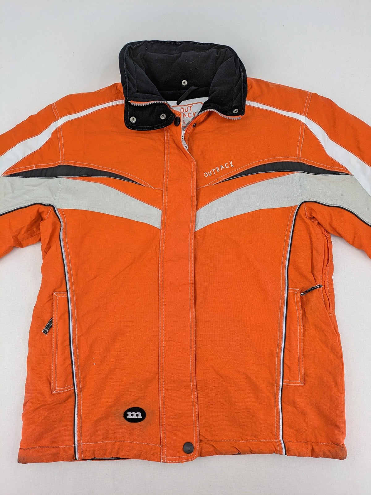 Outback orange outdoor jacket size 42 with reflective accents and mixed color details.