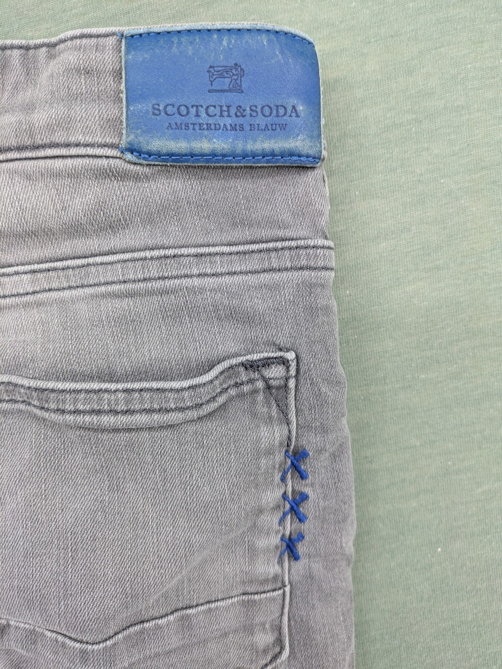 Scotch & Soda grey straight jeans with classic five-pocket design and logo patch.
