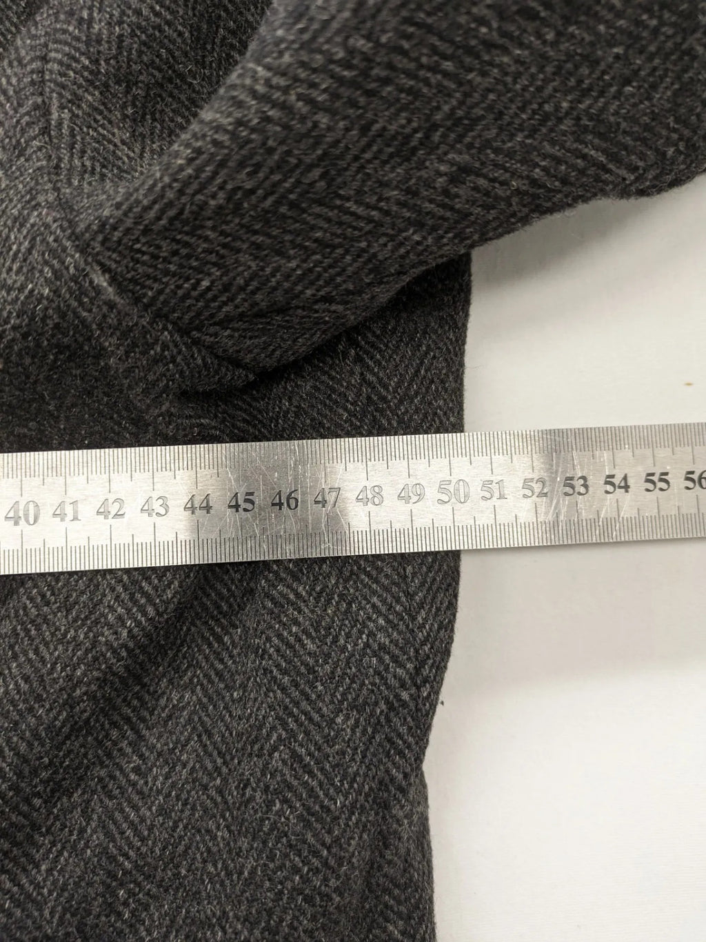 Jack & Jones grey coat herringbone pattern with two-button closure and side pockets.