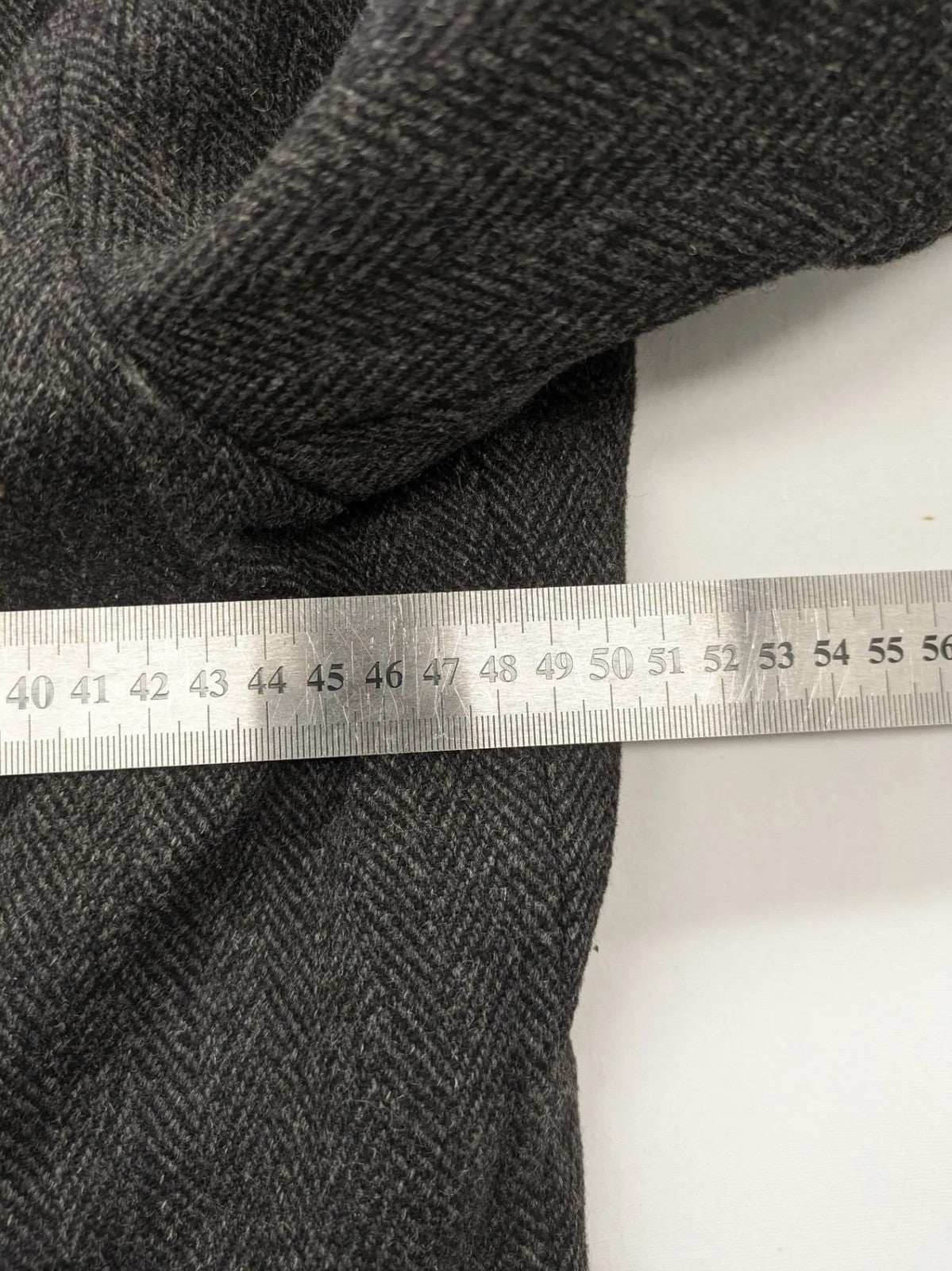 Jack & Jones grey coat herringbone pattern with two-button closure and side pockets.