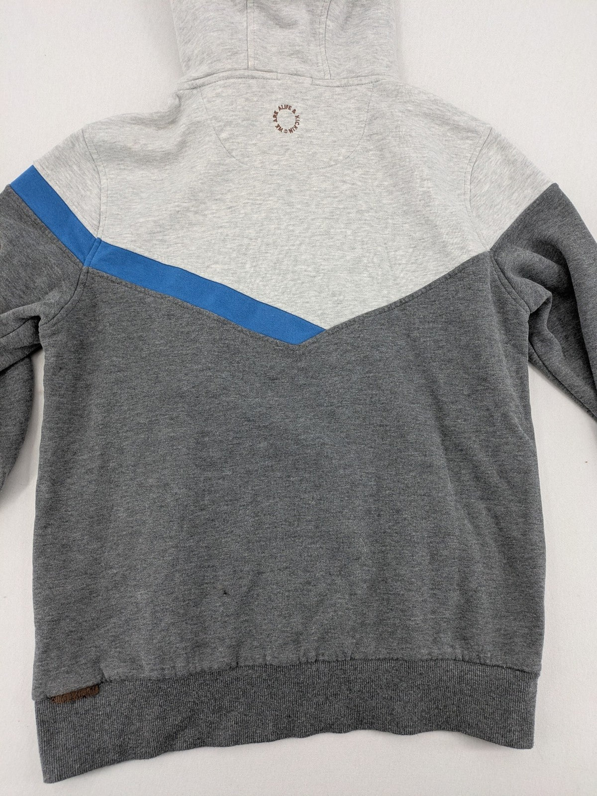 ALIFE turtle neck jumper blue grey colorblock design with logo details and soft cotton blend.