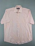 Ken Baker orange short-sleeve shirt with vertical stripes and chest pocket.