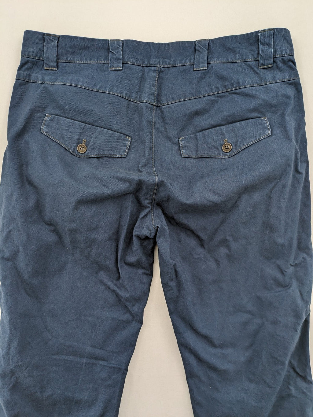 Marc O'Polo blue chino pants with button flap pockets and relaxed fit design.