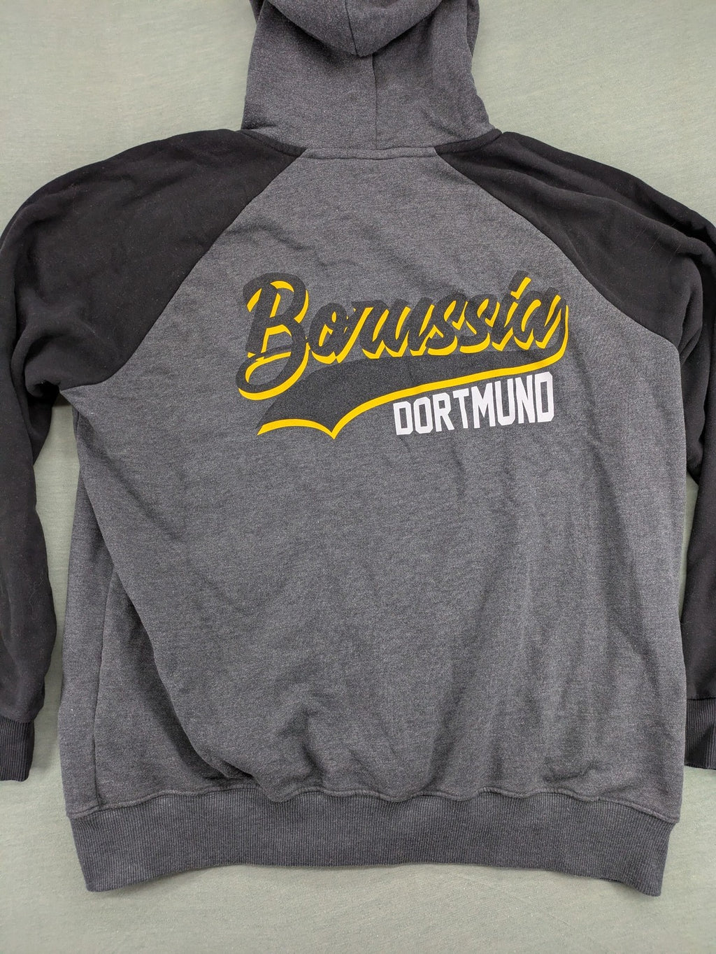 Borussia Dortmund grey and black hoodie with BVB 09 logo and full zip design.