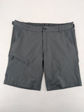 Outdoor grey functional shorts with adjustable velcro waistband and zippered leg pocket.