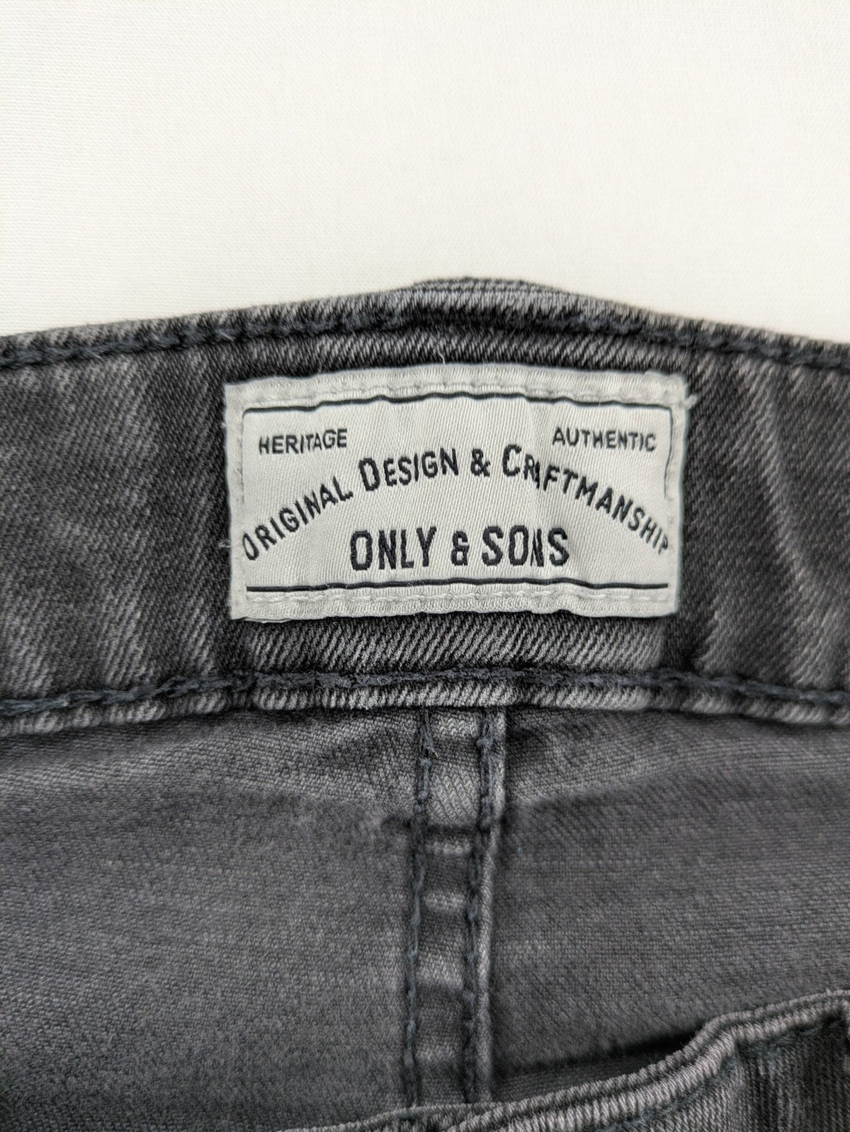 Only & Sons grey slim fit jeans with ripped details and open hem, stretch denim.