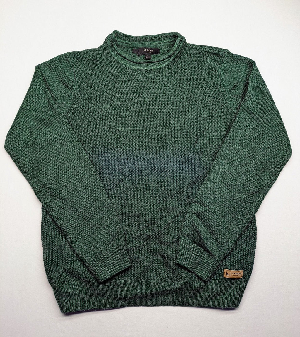 Broken Standard turtle neck jumper green waffle knit texture with classic round neckline.