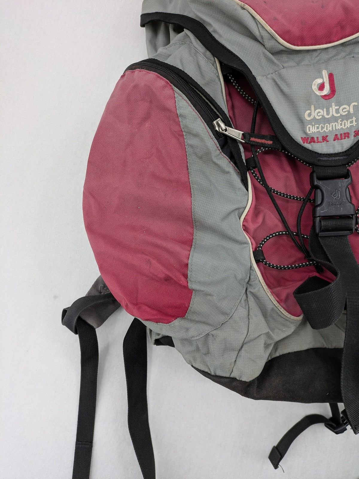 Deuter grey and pink Aircomfort Walk Air 30 rucksack with mesh back system.