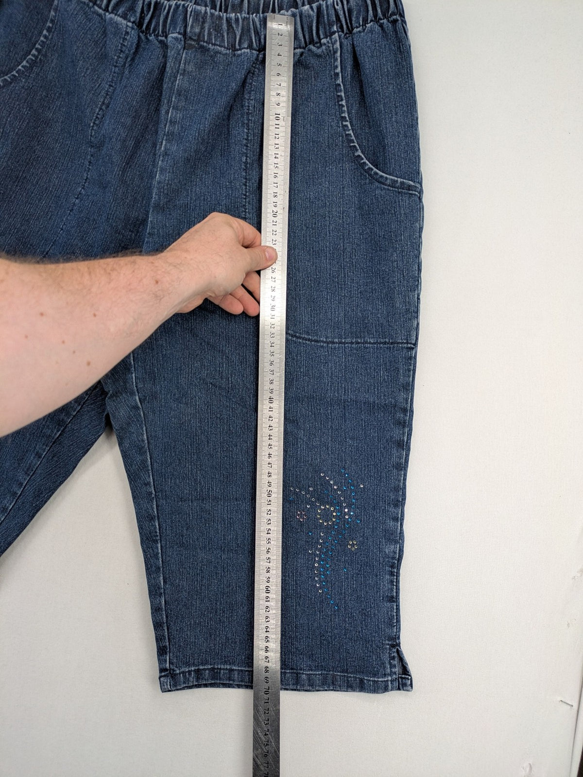 Denim & Co. blue capri jeans with elastic waistband and embellished rhinestones.