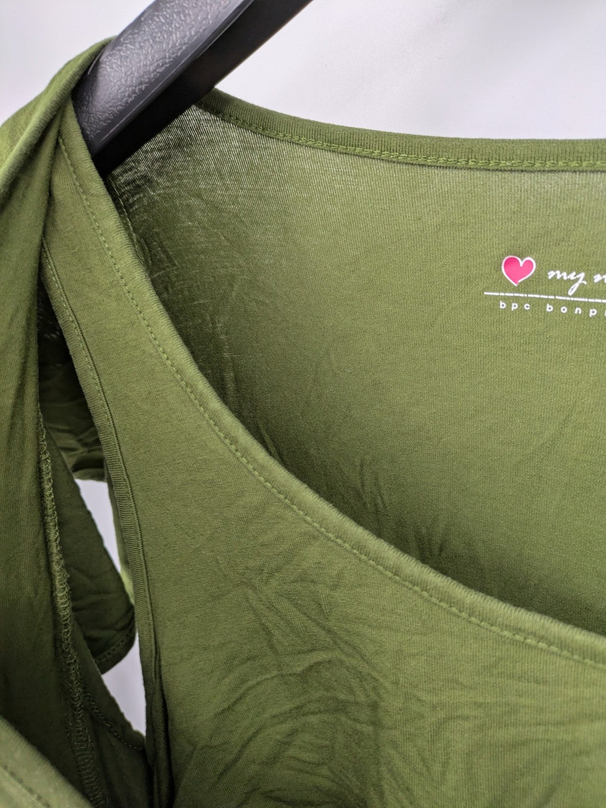 Bonprix green maternity dress with layered V-neck and empire waist design.
