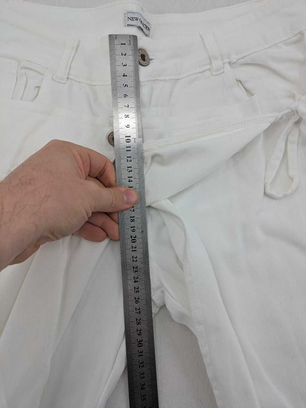 New Collection white straight jeans asymmetrical wrap design with side lacing and cotton-stretch material.