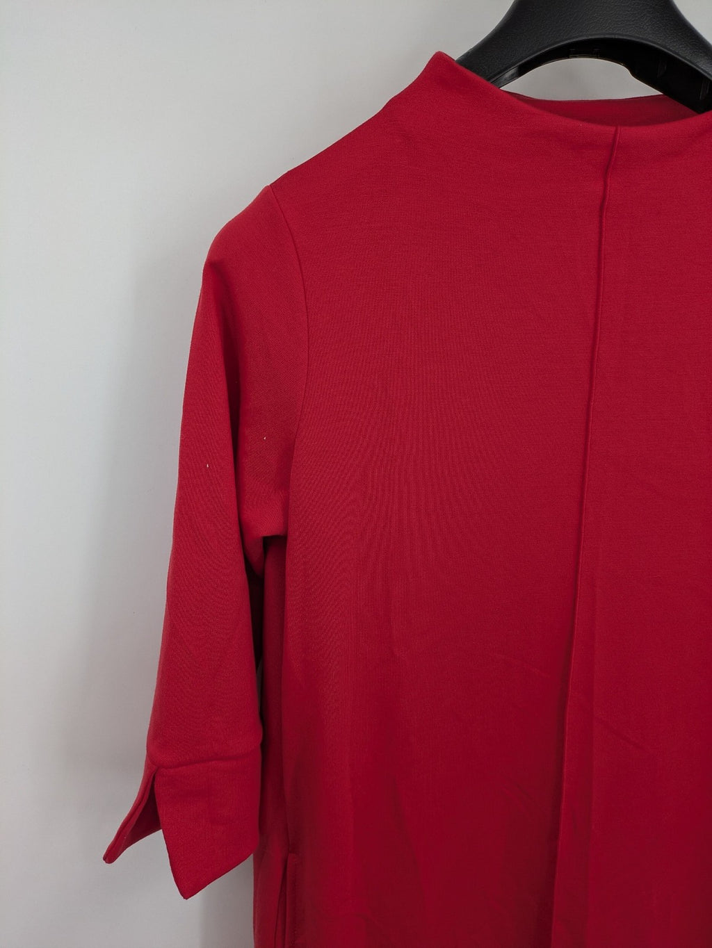 H&M red A-line dress with stand collar, 3/4 sleeves, and side pockets in stretchy jersey.