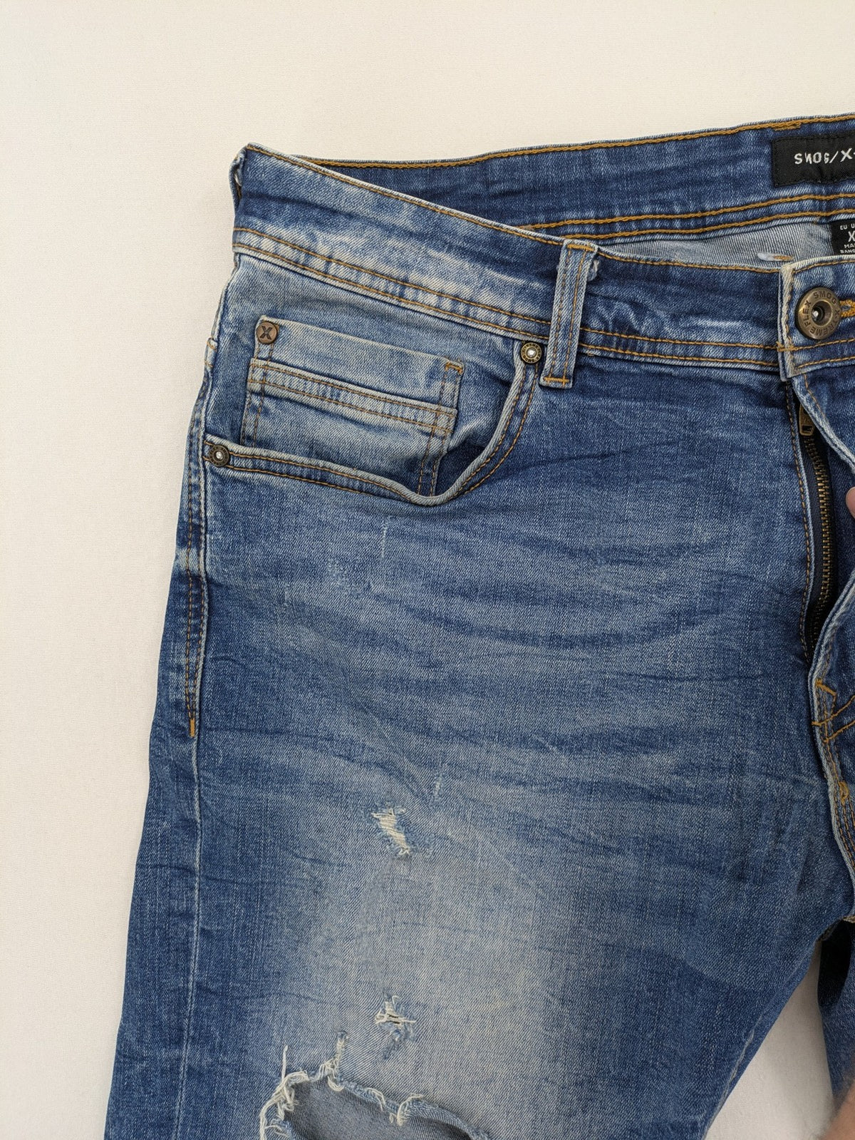 Smog blue denim shorts slim fit distressed details with rolled hem.