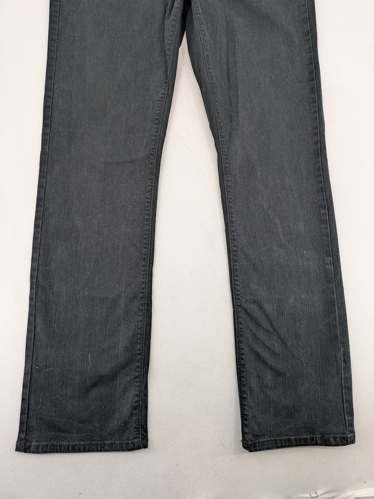 Yessica black straight jeans with classic dark wash and stretch denim material.
