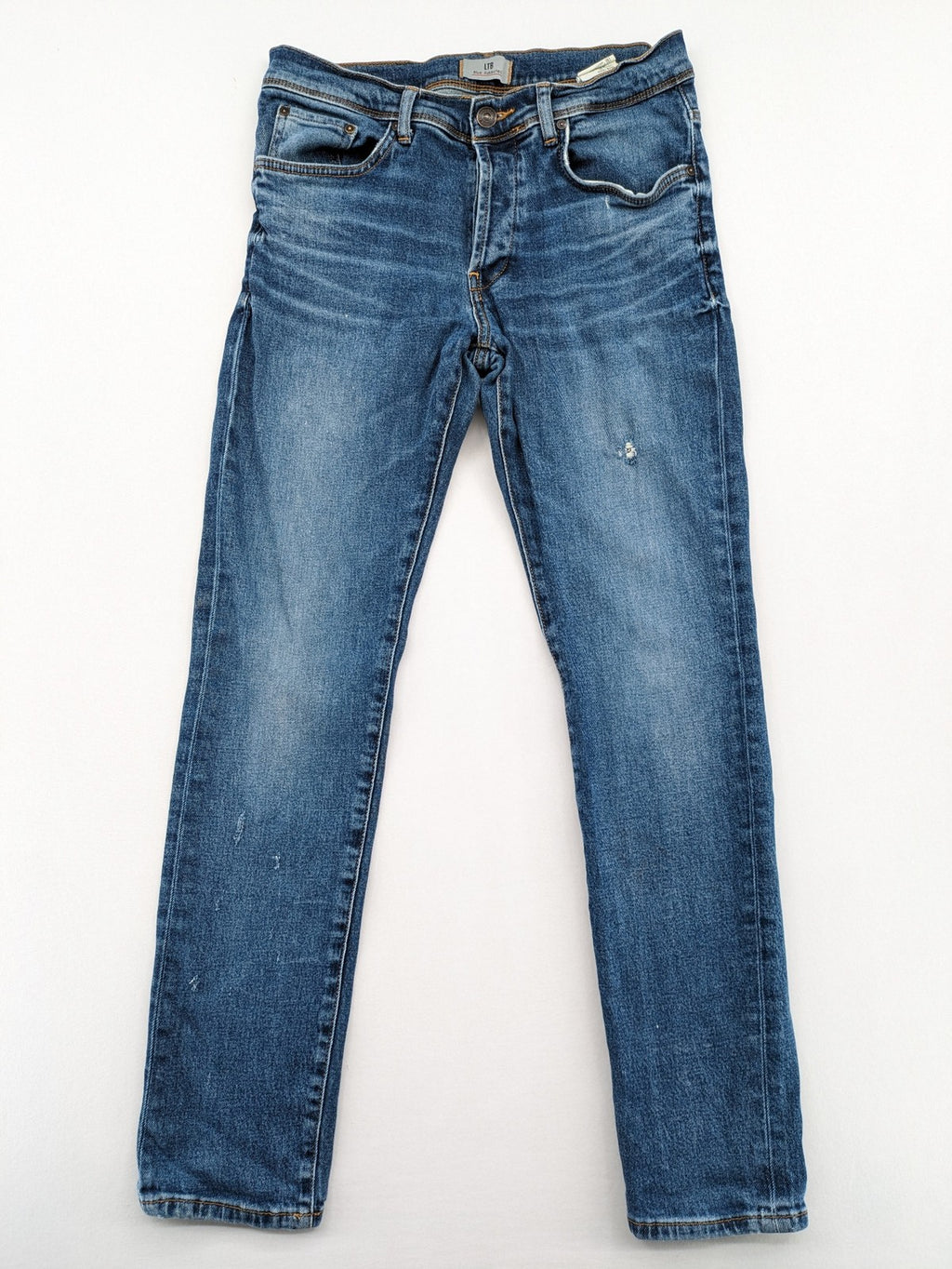LTB blue straight jeans with low rise, button fly, and classic denim wash.