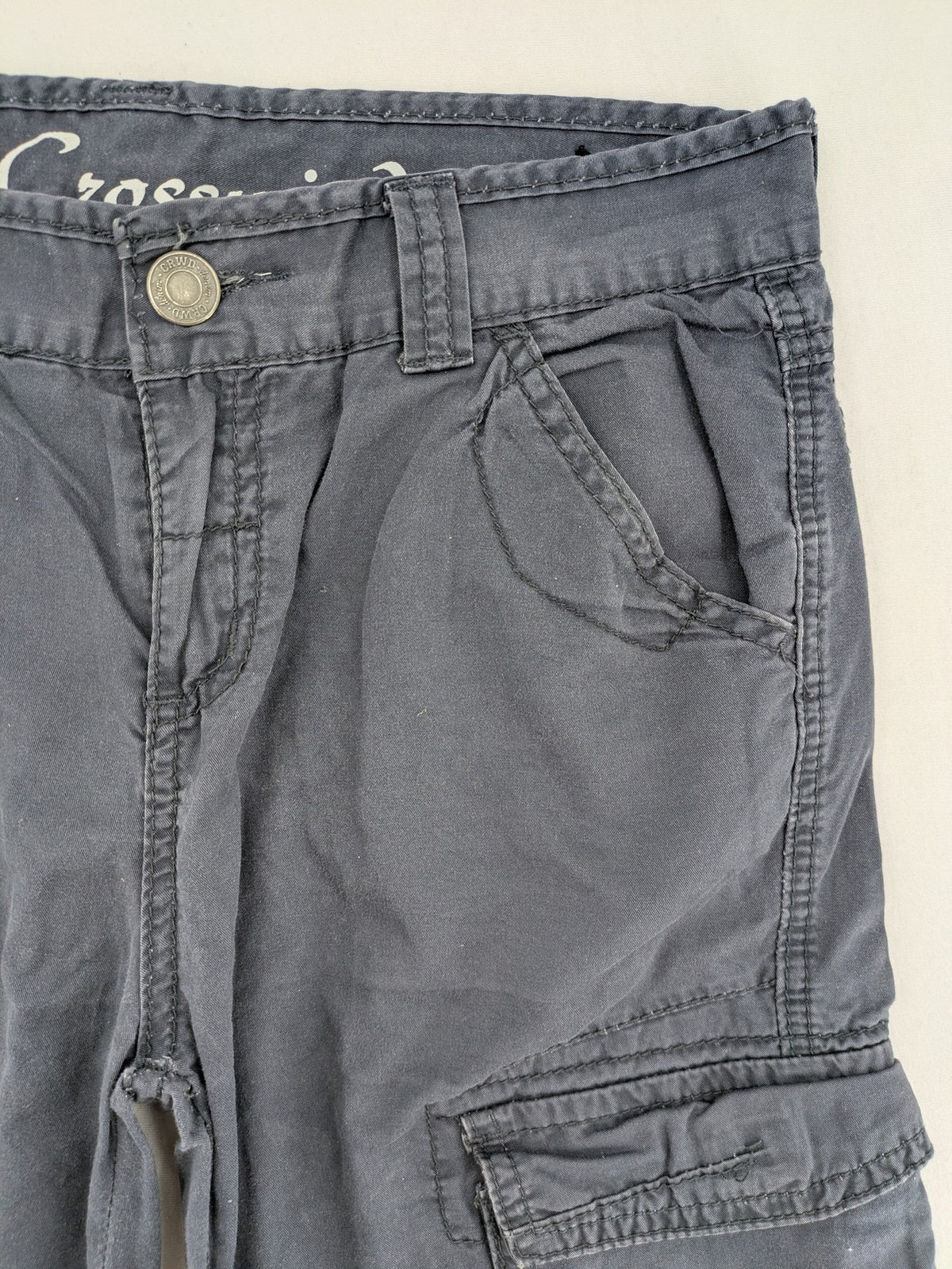 Crosswind grey cargo shorts with multiple pockets and durable cotton material.