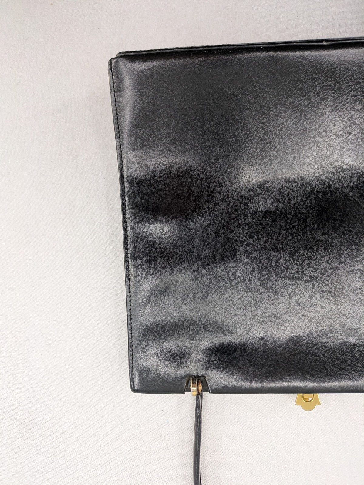 Eleganz black messenger bag vintage 50s 60s style with structured shape and gold accents.