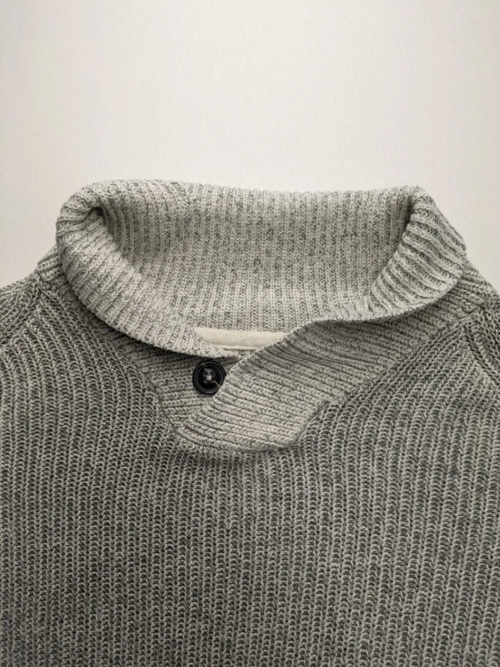 Autumn Glow grey turtle neck jumper with ribbed pattern and button detail.