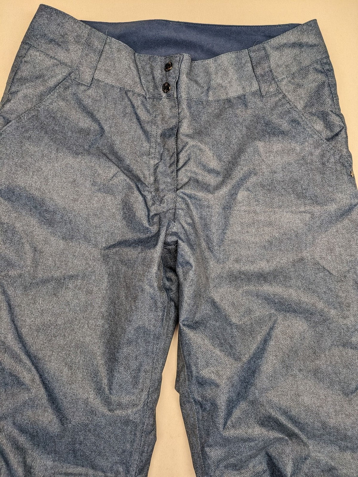 Snow Tech blue ski pants with modern denim look and durable polyester material.