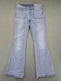 Diesel blue bootcut jeans with white patch pockets and regular waist, stylish stretch material.