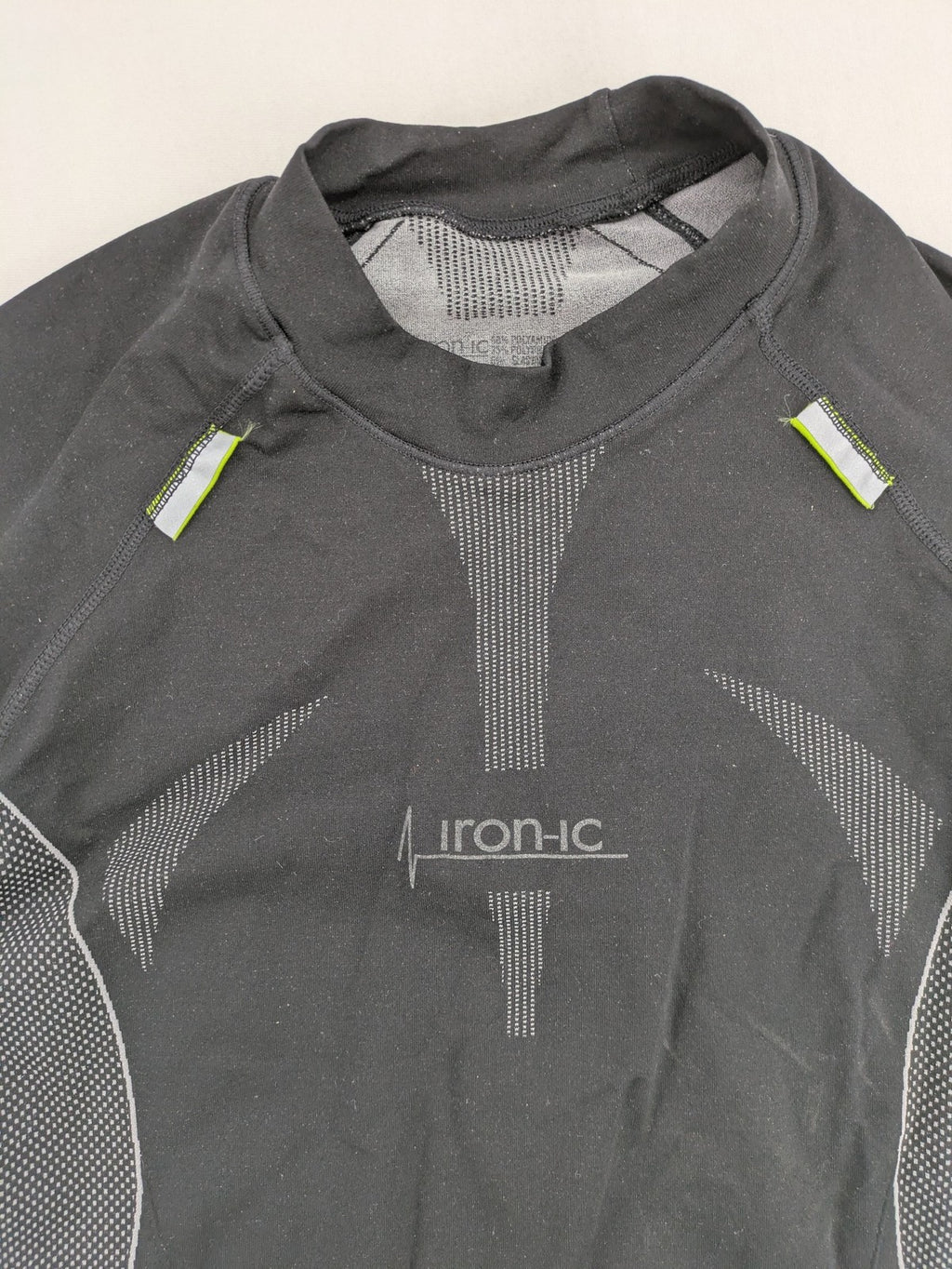 Iron-ic black long sleeve baselayer top with standing collar and thumbholes.
