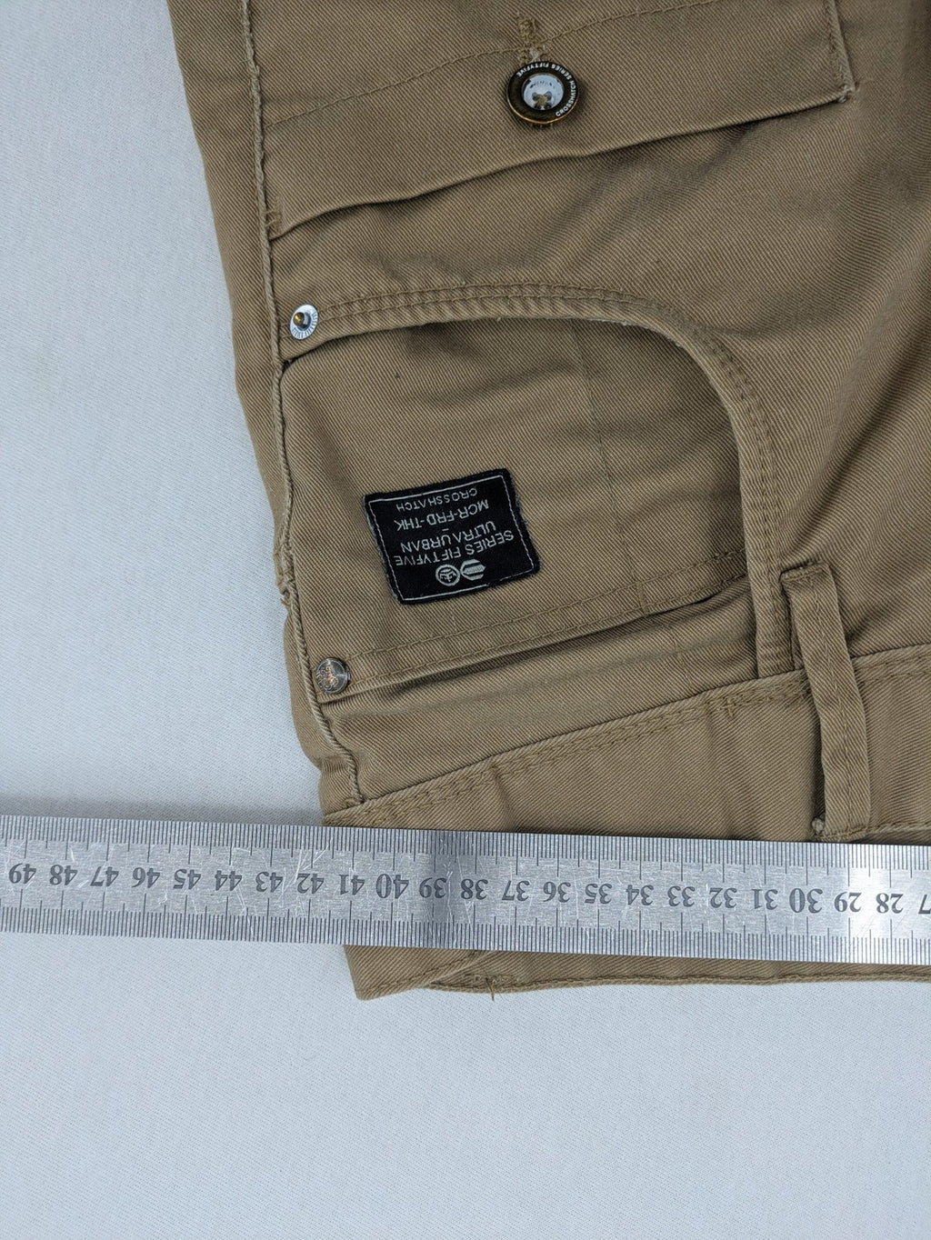 Crosshatch grey cargo pants with multiple pockets and durable cotton-polyester blend.