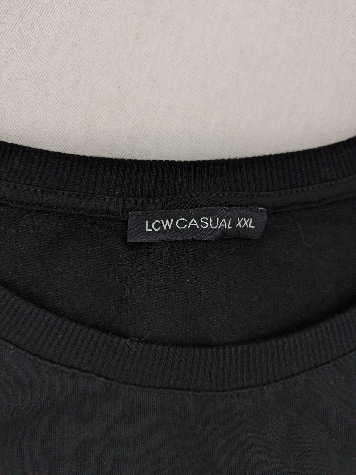 LC Waikiki black turtle neck jumper featuring Atatürk graphic print and signature.