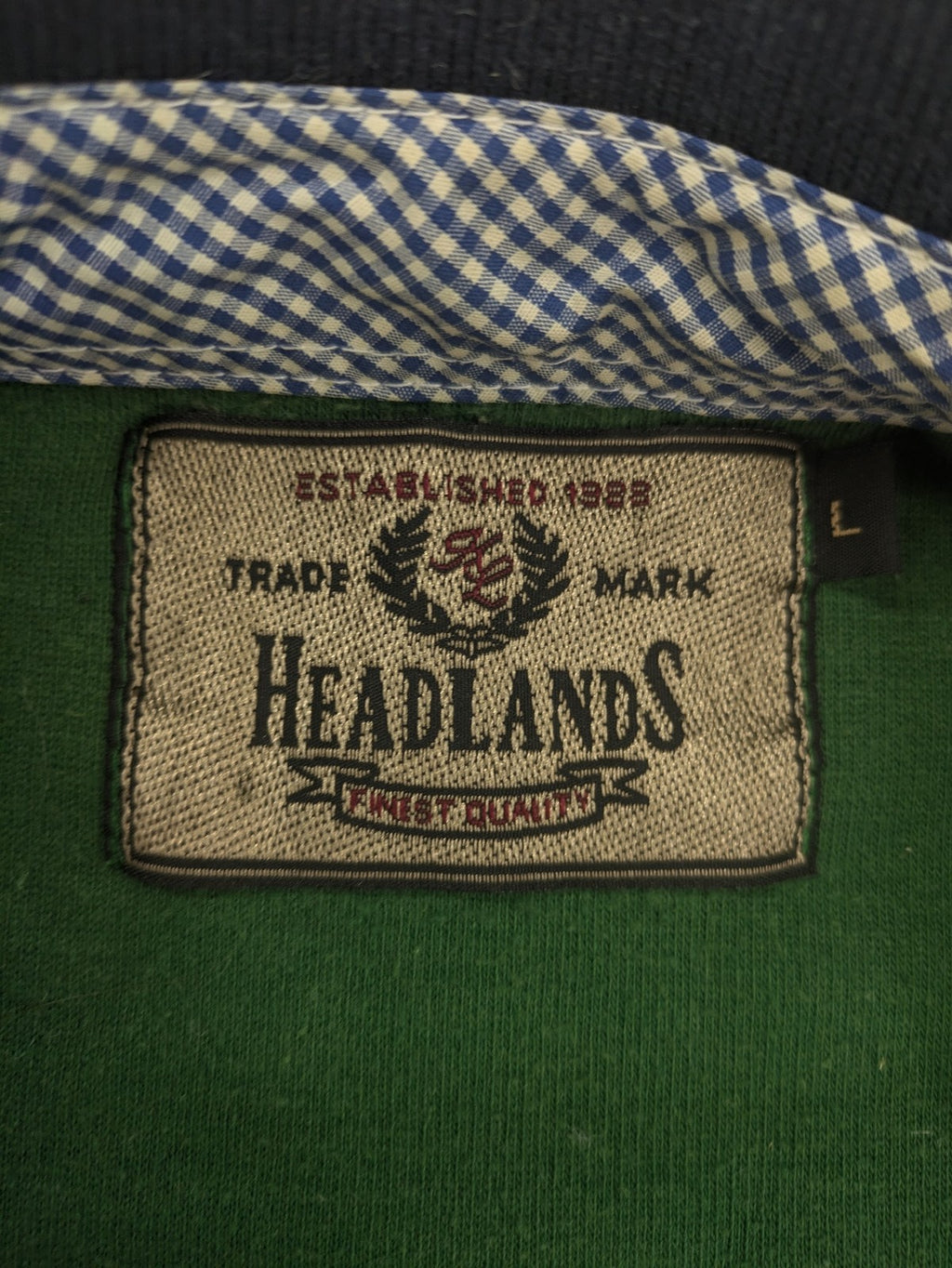 Headlands green turtle neck jumper with gingham collar and "Golden Beach" embroidery.