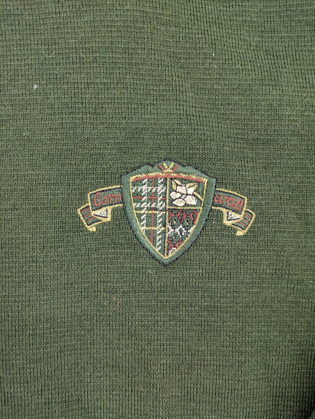 LUCIA green Trachtenjacke with embroidered crest, quilted collar, and decorative buttons.