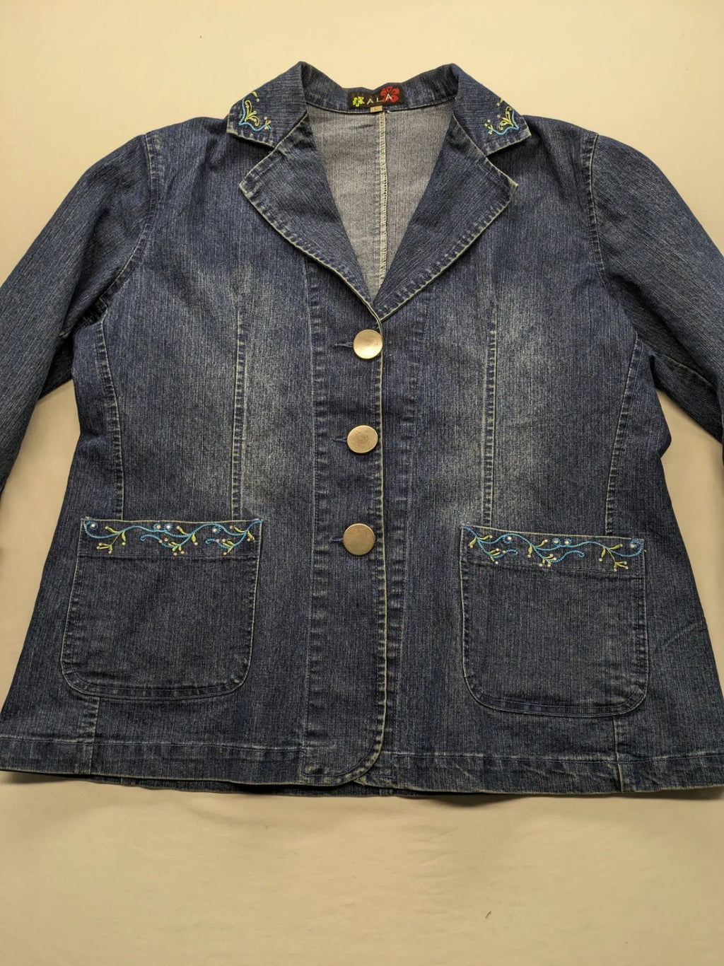 Zala blue denim blazer jacket with embroidered details and classic button closure.