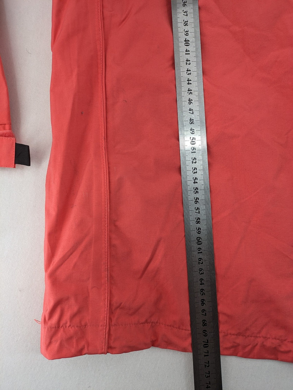 Black Bear black rain jacket with coral pink mesh lining and full zipper.