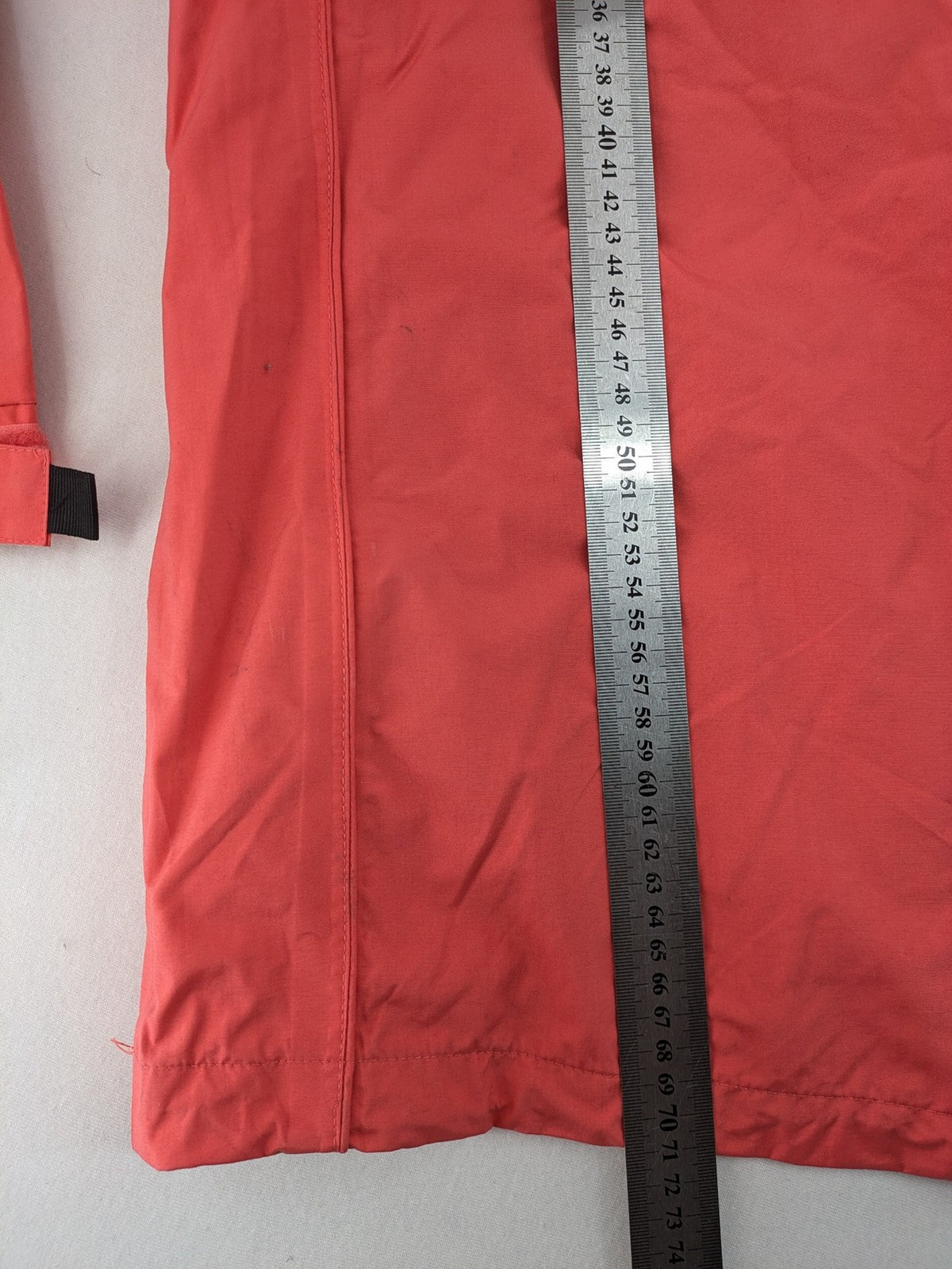 Black Bear black rain jacket with coral pink mesh lining and full zipper.