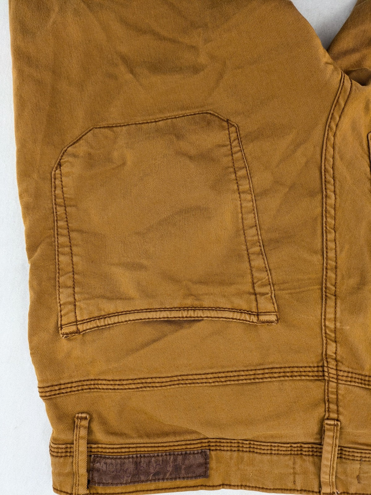 Bershka brown straight jeans slim fit classic 5-pocket design with prominent stitching.