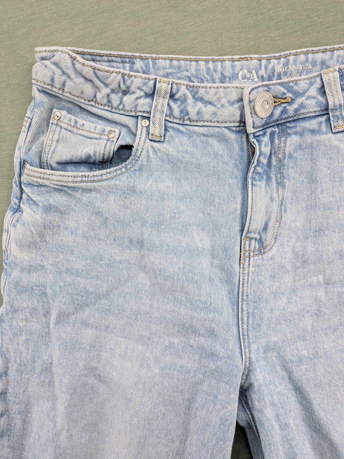 C&A blue wide leg jeans with distressed knee details and classic five-pocket design.