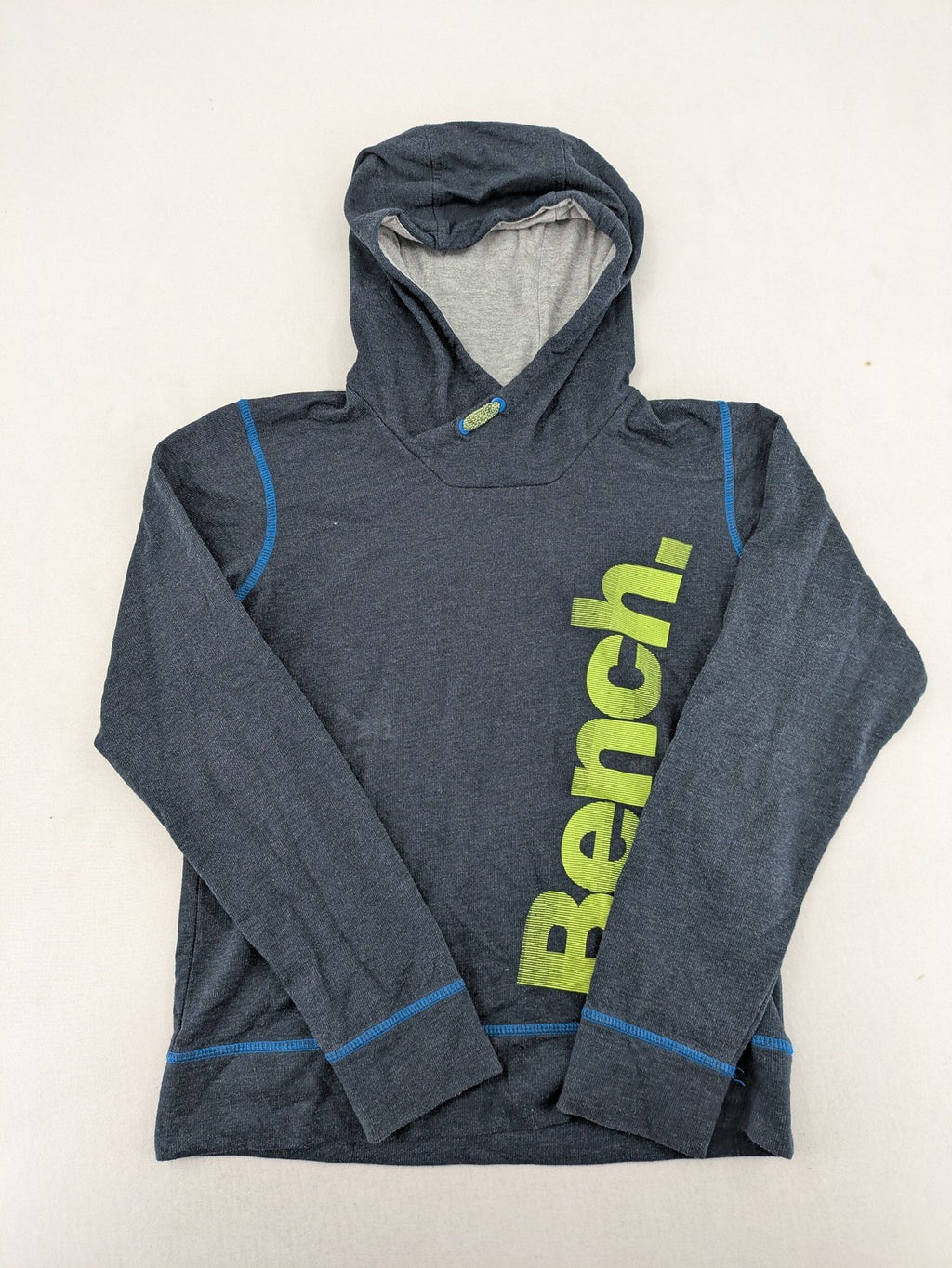 Bench hoodie dark grey with neon green logo and blue contrast stitching.