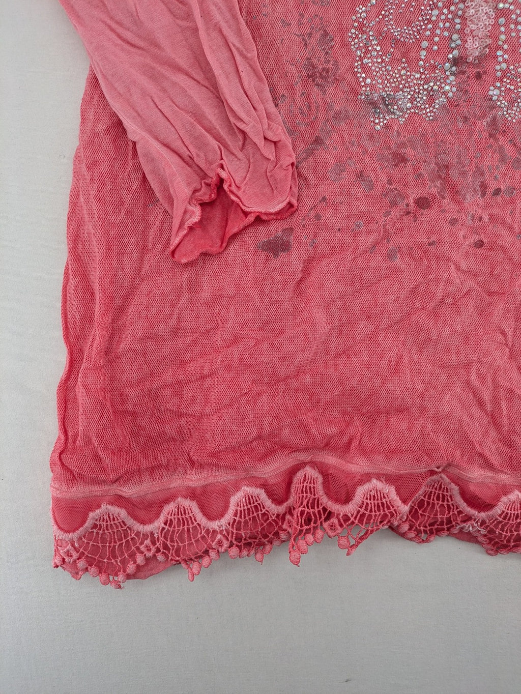TREDY pink top with butterfly graphic, embellished with rhinestones and lace accents.