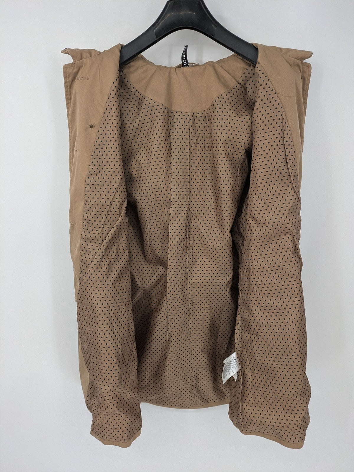 H&M Divided beige trench coat with button closure, hood, and polka dot lining.