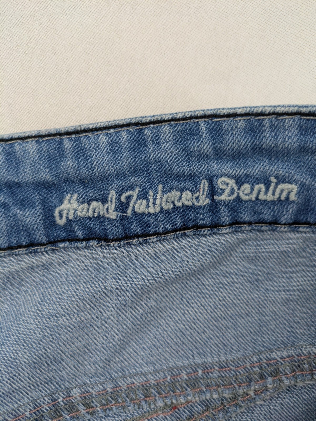 R-Neal blue straight jeans with red-white contrast stitching and classic 5-pocket design.