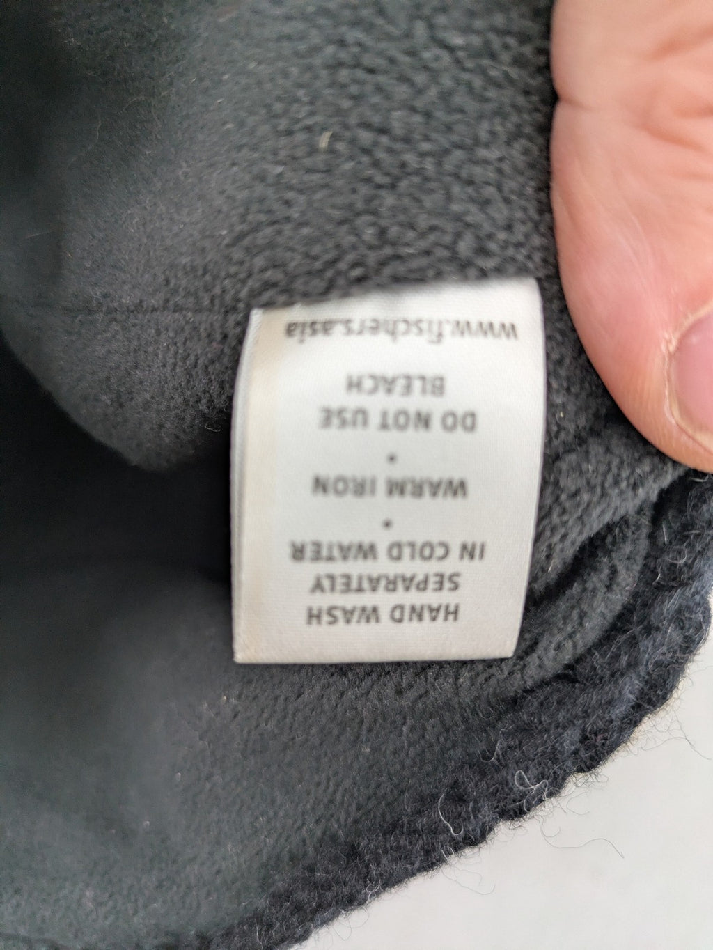 Fischers Textil multi beanie hand-knitted wool with fleece lining and floral appliqué.