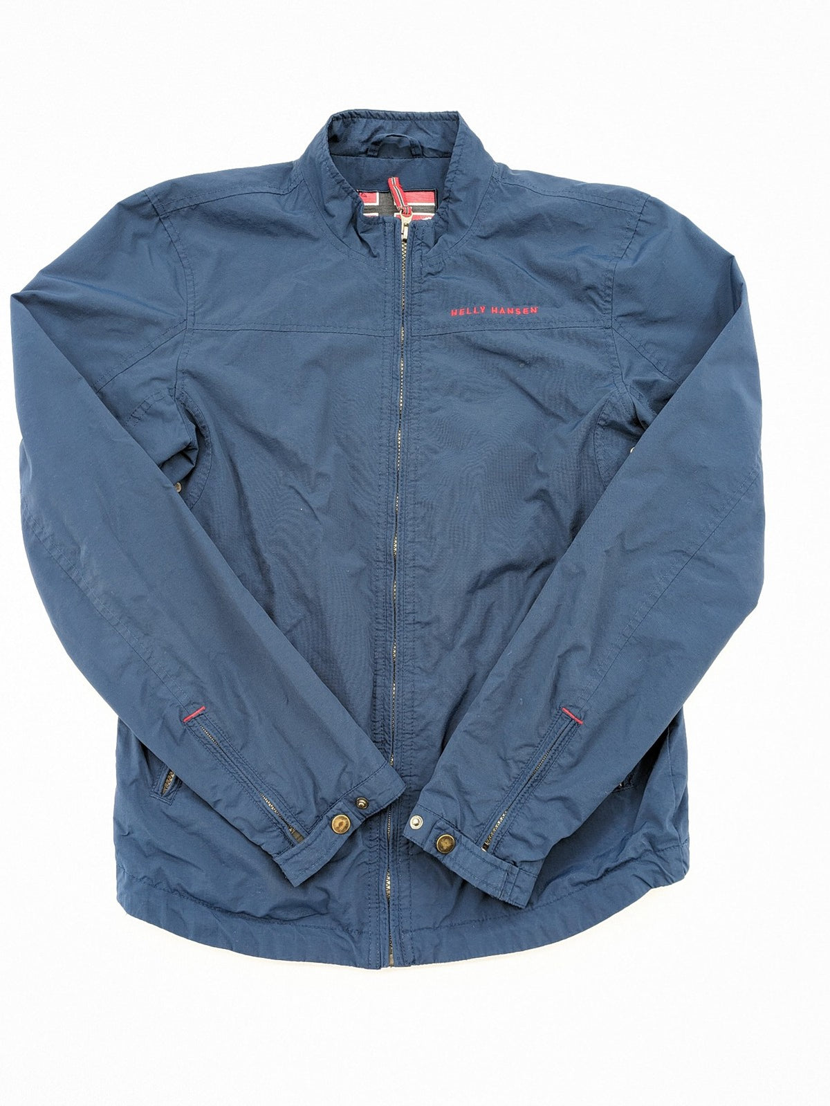 Helly Hansen navy jacket with red accents and logo, full zip, breathable mesh lining.
