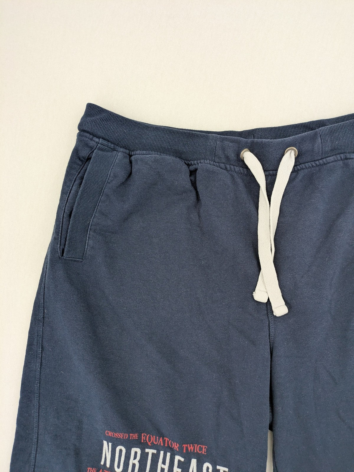 Livergy blue sweatshorts with "Northeast Sailors" graphic print and elastic waistband.