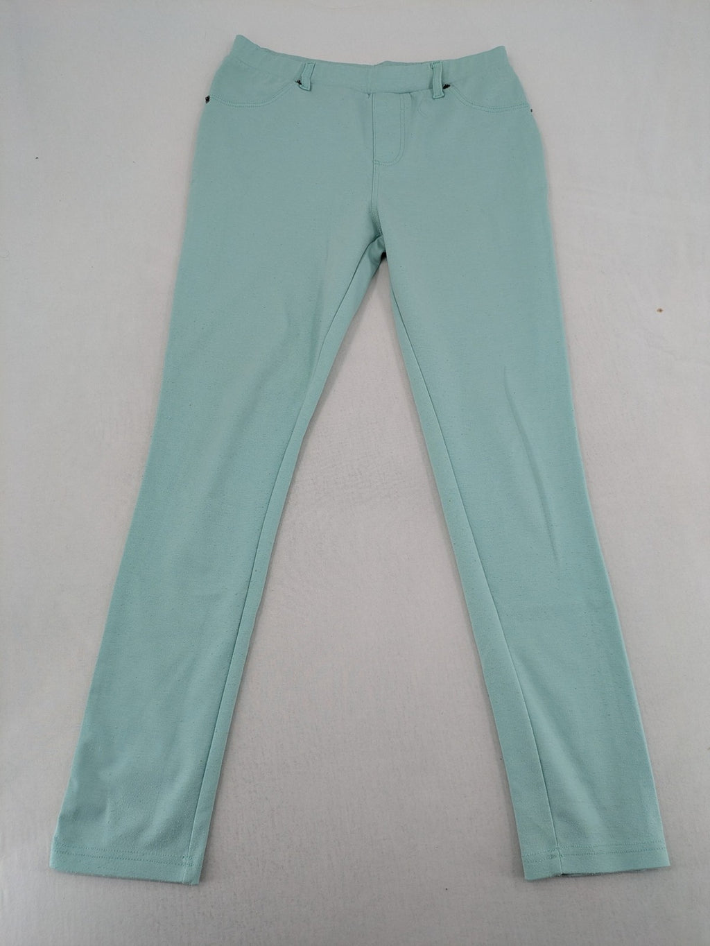 Dito green treggings with pull-on design, front pockets, and belt loops.